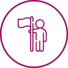 Simple icon of a person standing next to a flag, symbolizing independence and achievement.