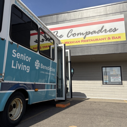 Benedictine Senior Living-Byron bus parked at restaurant.