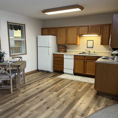 Bright kitchen and dining area with wooden cabinets and inviting natural light.