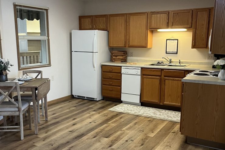 Bright kitchen and dining area with wooden cabinets and inviting natural light.