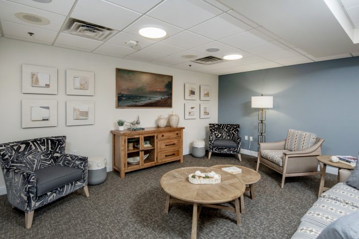 Comfortable seating area with calming decor and warm lighting for socializing and relaxation.