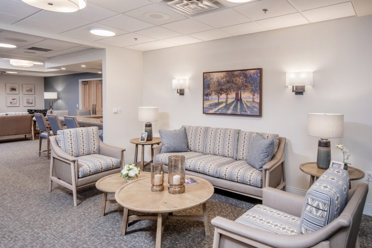 Well-lit lounge with comfortable seating and tasteful decor fostering a welcoming community space.