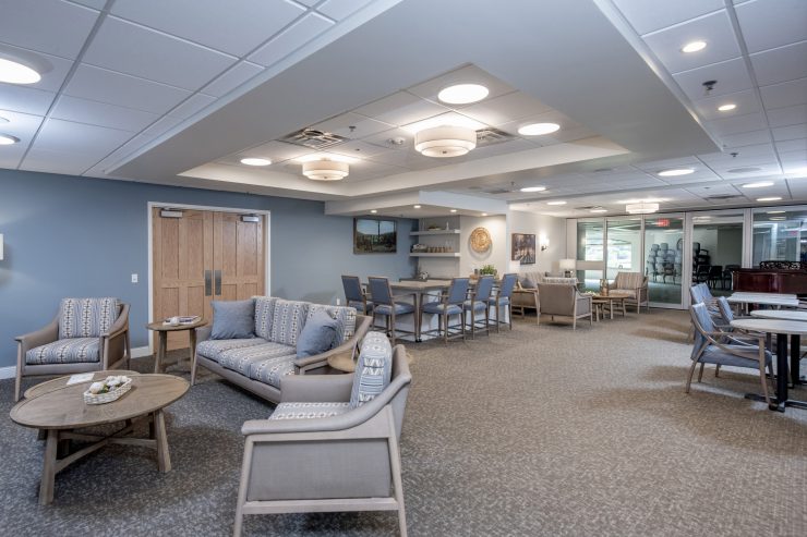 Spacious common area with comfortable seating and warm lighting for social gatherings and relaxation.