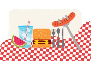 Picnic spread with burger, sausage, watermelon slice, and drink on a checkered tablecloth.