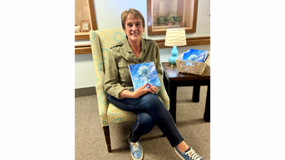 Author Amy Aanenson holding her book "My Wish for You"