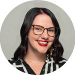 Warm, welcoming staff member with a friendly smile fostering a caring community atmosphere.