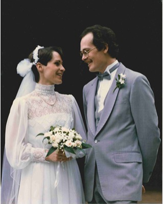 A joyful couple sharing a tender moment on their wedding day, symbolizing lasting love and commitment.