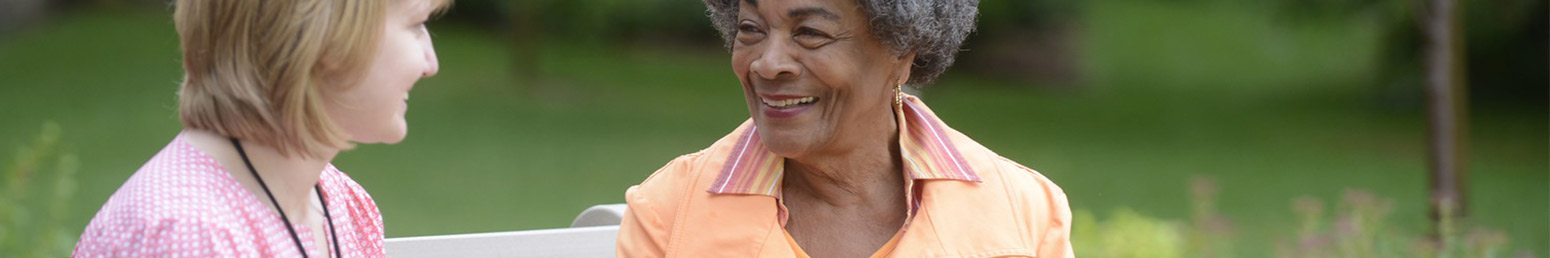 a senior woman smiling in a retirement community